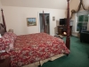 Old Fashion burgundy print with queen anne bed frame, TV and all season fireplace